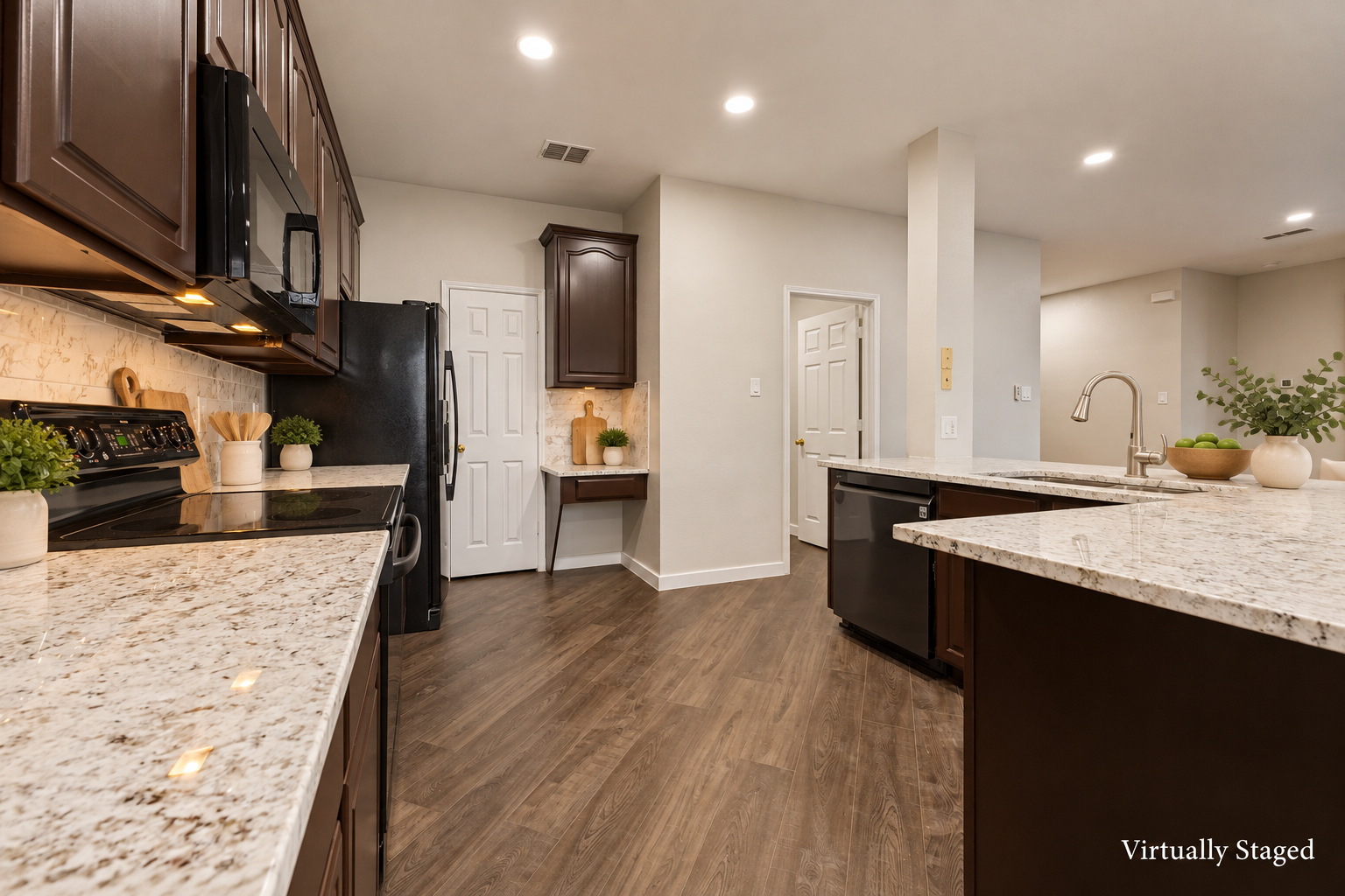 Virtually staged view of the kitchen counters and appliances at 4215 Maidstone Drive.