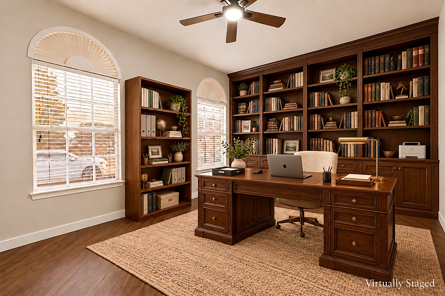Virtually staged view of the home office with built-in bookshelves and executive desk at 4215 Maidstone Drive.