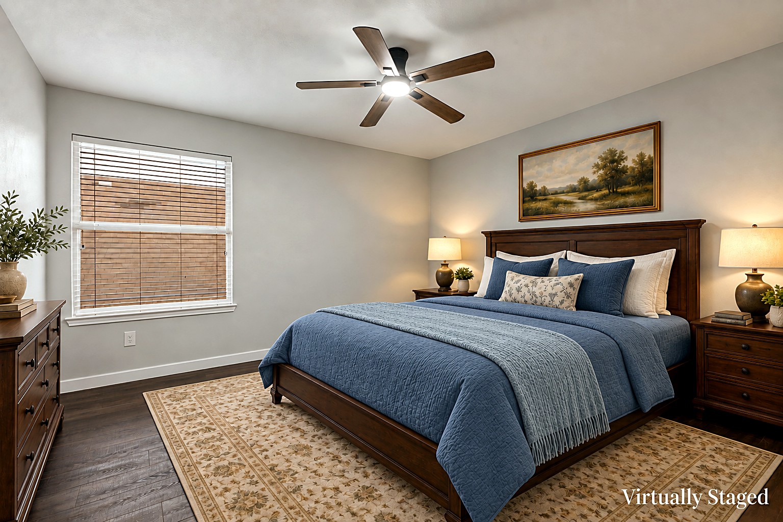 Virtually staged view of a secondary bedroom with blue bedding, ceiling fan, and backyard-facing window at 4215 Maidstone Drive.