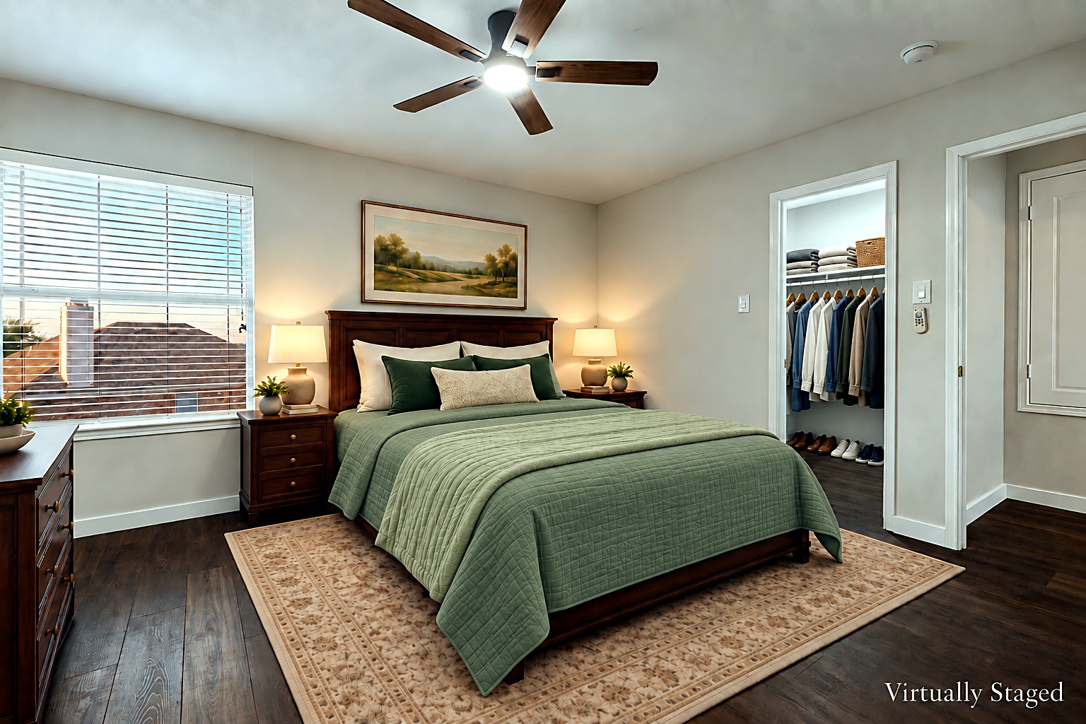 Virtually staged view of a secondary bedroom with sage green bedding, ceiling fan, and walk-in closet at 4215 Maidstone Drive.