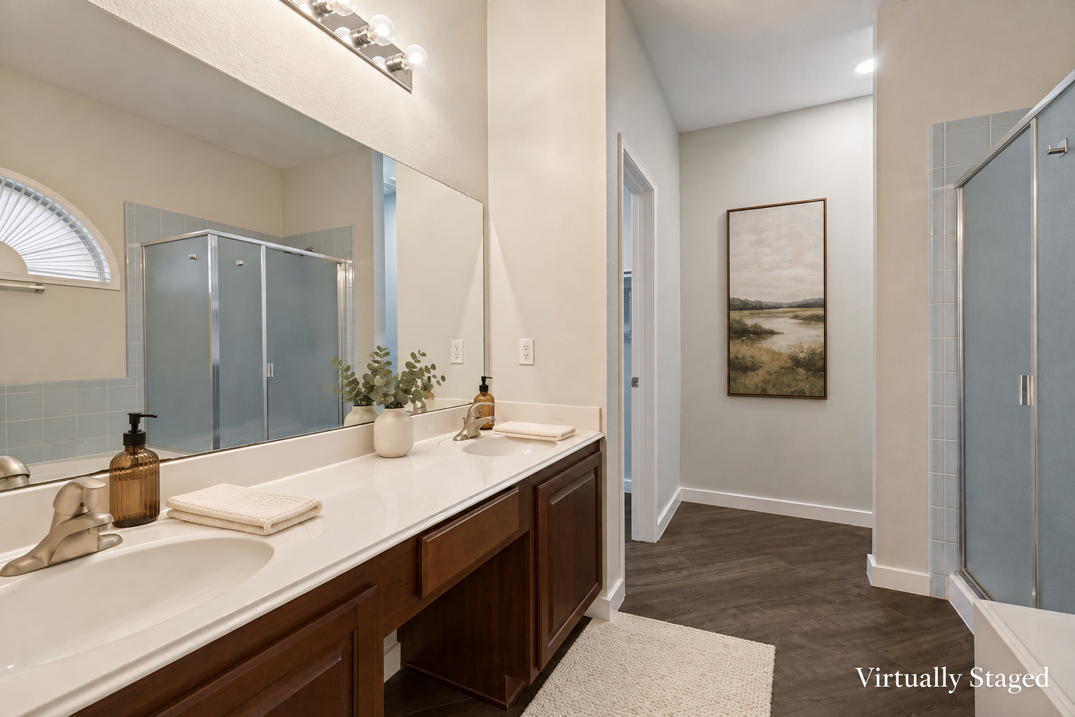 Virtually staged view of the primary suite bath with dual vanities and separate glass shower at 4215 Maidstone Drive.